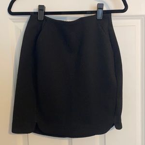 Black short tight fitting skirt